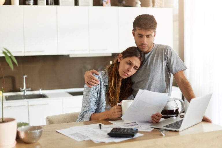 Negative human emotions. Financial problems. Portrait of unhappy young couple having looking worried